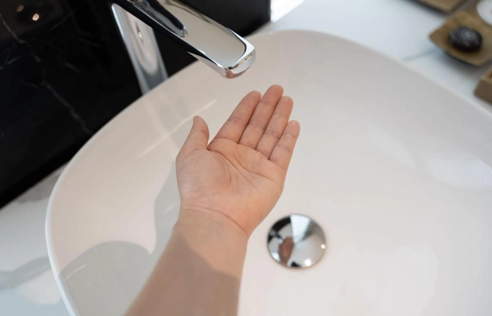 Premium touchless faucet installed in a high-end commercial restroom